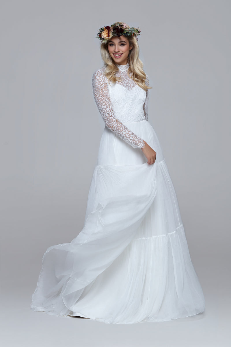 romantic boho wedding dress. Lace top with turtle neck and closed back with drop split. Layered silk chiffon skirt.