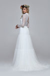 romantic boho wedding dress. Lace top with turtle neck and closed back with drop split. Layered silk chiffon skirt.