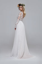 Shiny wedding dress. Beaded top with silk tulle skirt. Boat neckline open back.