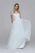 Wedding dress with beaded top and silk chiffon skirt. Boat neckline with V-back.