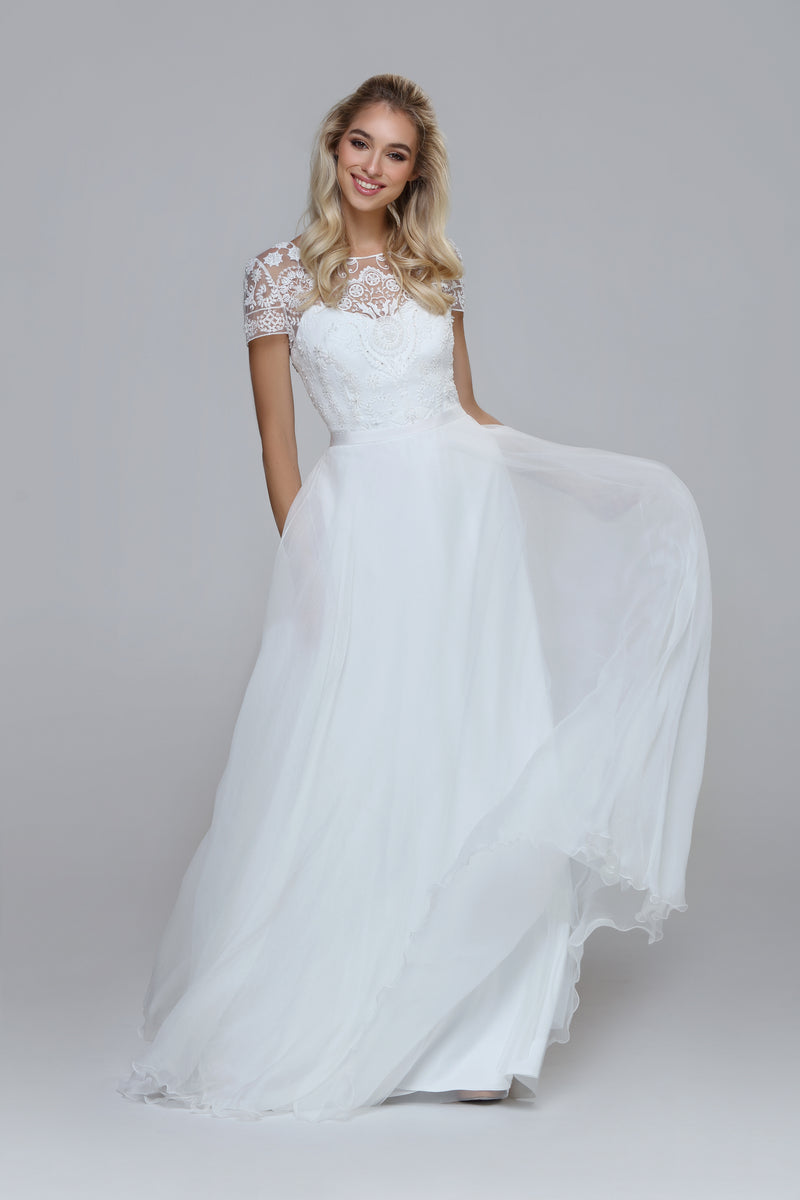 Wedding dress with beaded top and silk chiffon skirt. Boat neckline with V-back.