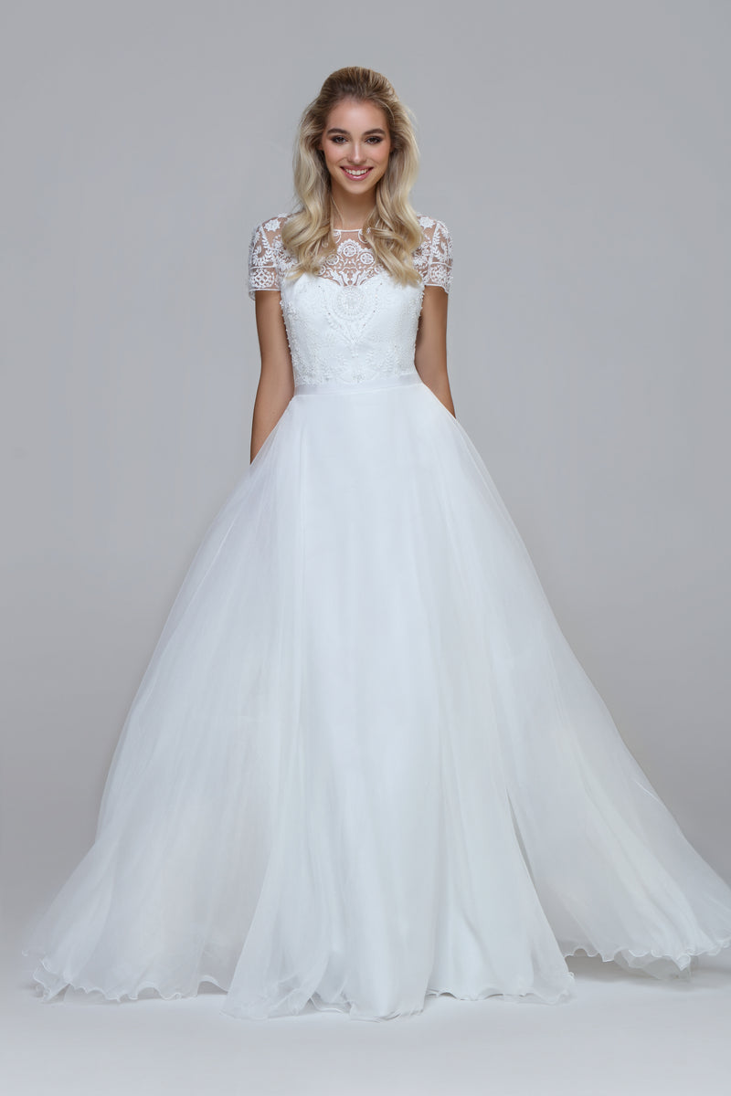 Wedding dress with beaded top and silk chiffon skirt. Boat neckline with V-back.
