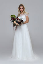 Wedding dress with beaded top and silk chiffon skirt. Boat neckline with V-back.